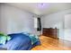 Bedroom featuring neutral walls, hardwood floors, and ample natural light at 428 Cornish Mountain Rd, Oxford, GA 30054