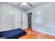 Bedroom featuring hardwood floors, neutral walls, and a closet at 428 Cornish Mountain Rd, Oxford, GA 30054