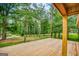 Newly constructed wooden deck showcasing the surrounding green landscape and mature trees at 428 Cornish Mountain Rd, Oxford, GA 30054