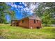 Well-maintained brick home with lush green lawn and mature trees at 428 Cornish Mountain Rd, Oxford, GA 30054