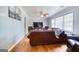 Cozy living room features hardwood floors, a ceiling fan, and a large window at 428 Cornish Mountain Rd, Oxford, GA 30054