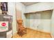 Well-lit storage area with shelving, a chair, and a hot water heater at 428 Cornish Mountain Rd, Oxford, GA 30054