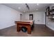 Spacious basement featuring a pool table, ample lighting, and a clean, modern design at 125 High Bluff Trl, Carrollton, GA 30116