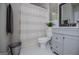 Cozy bathroom with hex tile flooring, a gray vanity, and a combined shower and tub at 125 High Bluff Trl, Carrollton, GA 30116