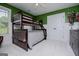 Bedroom with white wainscoting, featuring a bunk bed and trophy display at 125 High Bluff Trl, Carrollton, GA 30116