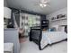 Bedroom boasts a wooden crib, hanging chair, and grey accents at 125 High Bluff Trl, Carrollton, GA 30116