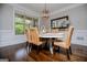 Dining room features a light fixture and a large window, providing bright and neutral appeal at 125 High Bluff Trl, Carrollton, GA 30116
