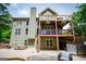 Gorgeous home with a multi-story deck perfect for entertaining, overlooking the yard at 125 High Bluff Trl, Carrollton, GA 30116