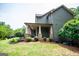 Covered patio with stone columns and landscaping at 125 High Bluff Trl, Carrollton, GA 30116