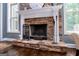 Close-up of the fireplace with a stone surround and mantel at 125 High Bluff Trl, Carrollton, GA 30116