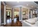 Open-concept living is displayed from the foyer through the dining room, with neutral walls and hardwood floors at 125 High Bluff Trl, Carrollton, GA 30116