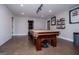 Spacious game room featuring a classic-style pool table, recessed lighting, and neutral wall colors at 125 High Bluff Trl, Carrollton, GA 30116