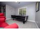 A cozy room with an air hockey table and comfortable seating near a bright window at 125 High Bluff Trl, Carrollton, GA 30116