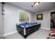 Game room featuring an air hockey table and a window with bright natural light at 125 High Bluff Trl, Carrollton, GA 30116