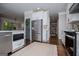 Bright kitchen boasts stainless steel appliances, white cabinetry, and modern decor at 125 High Bluff Trl, Carrollton, GA 30116