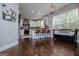 Bright kitchen features a large island with barstool seating, stainless steel appliances, and decorative backsplash at 125 High Bluff Trl, Carrollton, GA 30116