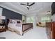 Spacious main bedroom features trey ceiling, sitting area, and access to private balcony at 125 High Bluff Trl, Carrollton, GA 30116