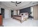 Bright primary bedroom with large windows, trey ceilings, a ceiling fan, and ensuite bath with sliding door at 125 High Bluff Trl, Carrollton, GA 30116