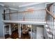 View of second-floor landing overlooking the living room and dining area at 125 High Bluff Trl, Carrollton, GA 30116