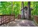 View of an outdoor treehouse with a wooden deck railing at 125 High Bluff Trl, Carrollton, GA 30116