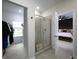 Bathroom featuring glass enclosed shower and doorway to bedroom at 2108 Remy Ct, Kennesaw, GA 30144