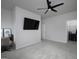 Spacious bedroom with modern ceiling fan, large TV, neutral walls, and adjoining walk-in closet at 2108 Remy Ct, Kennesaw, GA 30144