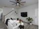 Comfortable living area featuring a cozy couch, modern decor, and staircase at 2108 Remy Ct, Kennesaw, GA 30144