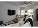 Inviting living area with contemporary furnishings, a large TV, and lots of natural light at 2108 Remy Ct, Kennesaw, GA 30144