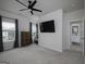 Bright, spacious main bedroom featuring a ceiling fan and en suite bathroom at 2108 Remy Ct, Kennesaw, GA 30144