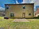 Spacious backyard featuring a concrete patio and ample lawn space for outdoor activities and relaxation at 620 Sedona Loop, Hampton, GA 30228