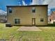 Home's backyard featuring a patio and grassy area at 620 Sedona Loop, Hampton, GA 30228