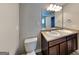 Bathroom showcasing double sinks, a large mirror, and a toilet at 620 Sedona Loop, Hampton, GA 30228