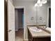 Clean bathroom with a vanity sink, a countertop, and a large mirror at 620 Sedona Loop, Hampton, GA 30228