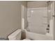 Modern bathroom with a shower-tub combo and a white toilet at 620 Sedona Loop, Hampton, GA 30228