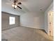 Bedroom with carpet flooring, a ceiling fan, and a window at 620 Sedona Loop, Hampton, GA 30228