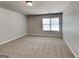 Comfortable bedroom with neutral carpeting and a bright window at 620 Sedona Loop, Hampton, GA 30228