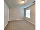 Bright and spacious bedroom with neutral carpet, trim, and walls at 620 Sedona Loop, Hampton, GA 30228