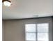 Bright and spacious bedroom with neutral carpet, trim, and walls at 620 Sedona Loop, Hampton, GA 30228
