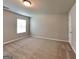 Spacious carpeted bedroom with neutral walls and natural light from the window at 620 Sedona Loop, Hampton, GA 30228
