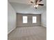 Bedroom with two windows and carpeted floors at 620 Sedona Loop, Hampton, GA 30228