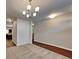 Bright dining room with modern chandelier, carpet and durable flooring at 620 Sedona Loop, Hampton, GA 30228