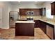 Modern kitchen with granite countertops, stainless steel appliances, and central island at 620 Sedona Loop, Hampton, GA 30228