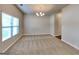 Living room featuring carpeted floors, a large window, and a chandelier at 620 Sedona Loop, Hampton, GA 30228