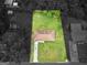 Aerial view showcases a rectangular, grassy lot surrounding the home with a long driveway at 840 Jett Rd, Jonesboro, GA 30236