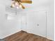 Bright bedroom featuring hardwood floors, a ceiling fan, and convenient access to a door and closet at 840 Jett Rd, Jonesboro, GA 30236