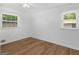 Inviting bedroom boasting hardwood floors and natural light from two windows, offering a cozy atmosphere at 840 Jett Rd, Jonesboro, GA 30236