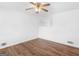 Bright bedroom with hardwood floors, a ceiling fan, and a built-in shelf at 840 Jett Rd, Jonesboro, GA 30236