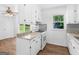 Charming kitchen with white cabinets, granite countertops, and a gas range stove at 840 Jett Rd, Jonesboro, GA 30236