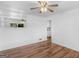 Living room with hardwood floors, a ceiling fan, and a built-in display at 840 Jett Rd, Jonesboro, GA 30236