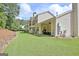 Spacious backyard with well-maintained lawn, patio area, and mature trees, perfect for outdoor enjoyment at 1801 Ridgefield Dr, Peachtree City, GA 30269
